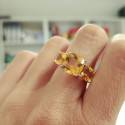 18 KTES GOLD RING WITH 3 YELLOW QUARTZS