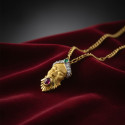 ORIENTAL FACE PENDANT WITH PRECIOUS STONES
