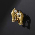 HANDS WITH PEARL EARRINGS